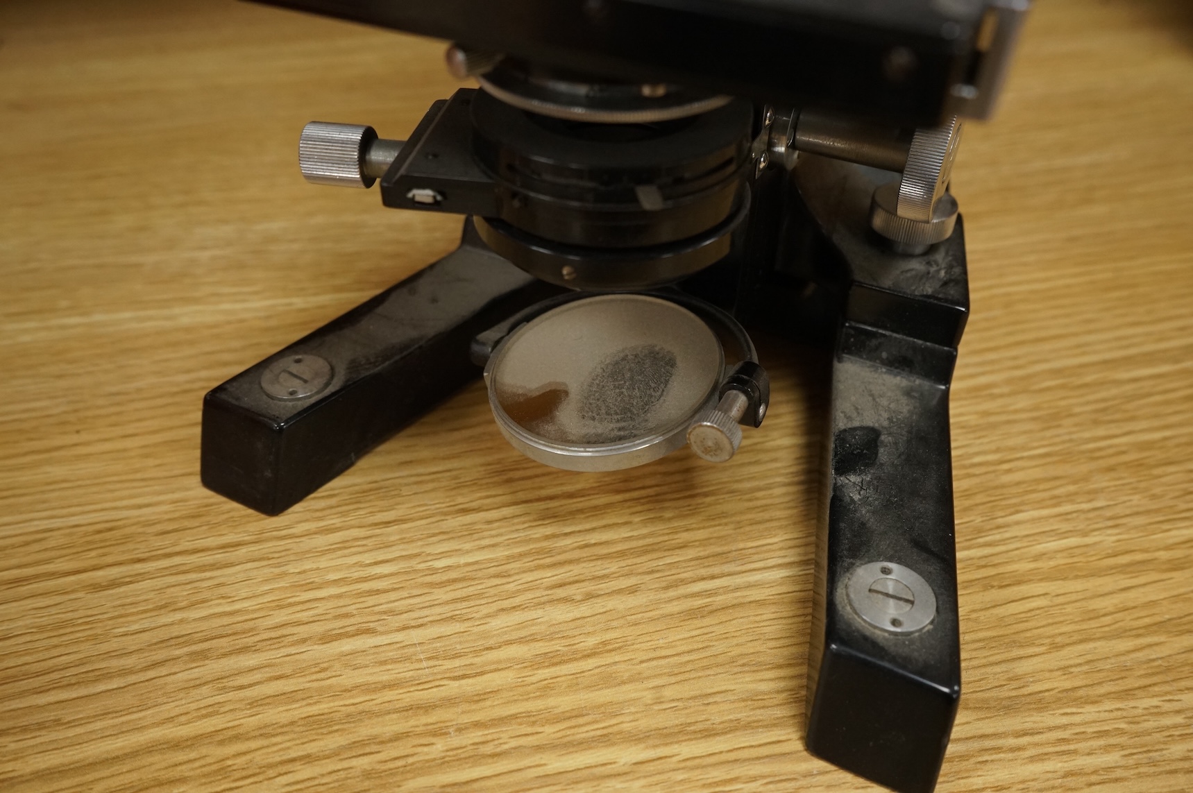 A mid 20th century Reichert, Austria binocular microscope, 34cm high.
